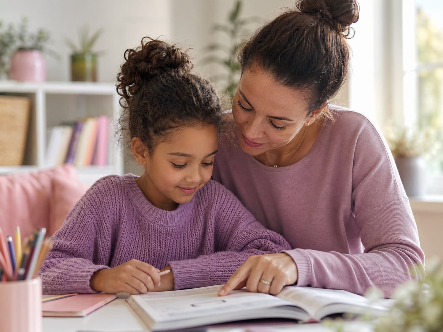 A parent supporting a child with a learning activity